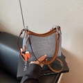 Blue fabric underarm bag with brown leather strap and orange horse charm detail - Denim Blue