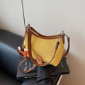 Yellow woven bucket bag with brown leather trim and a cute horse pendant decoration - Yellow