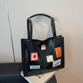Grande borsa tote in pelle nera con patch artistiche e comodi doppi manici per donna - Nero