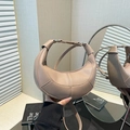 Chic khaki lychee pattern crescent shoulder bag with adjustable strap in a mirror reflection - Khaki