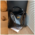 Detail of black quilted leather tote with gold twist lock and chain strap - Black
