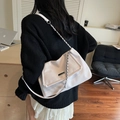 White pleated faux leather crossbody bag with metal buckle and chain strap on model - Off-white