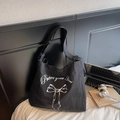 Large black canvas tote bag with bow print and adjustable strap for casual daily use - Black