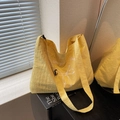 Bright yellow canvas tote bag with bow print and adjustable black shoulder strap - Yellow