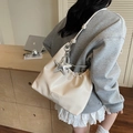Chic beige crossbody tote bag with pleated design and silver star charm detail - With Charm / White