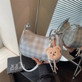 Gray checkered hobo bag with zip closure and plush bear charm for a stylish look - Silver