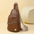 Brown faux leather sling bag with three zippers and geometric woven ethnic shoulder strap - Brown