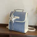 Blue denim and cream leather handbag with a silver star charm on a wooden surface - Beige (With Charm)