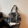 Large denim tote bag featuring grey patchwork design and striped canvas handles - Black