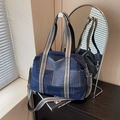 Dark blue denim tote bag with contrast stitching and striped shoulder strap in urban setting - Dark Blue