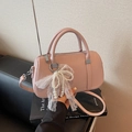 Pink lychee grain leather pillow bag with pearl lace bow charm and silver zipper - With Charm / Purple