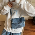 Vintage washed blue denim crossbody bag with V-shaped stitching and adjustable strap - Blue
