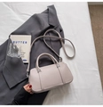 Minimalist beige lychee grain leather pillow bag with double handles and shoulder strap - No Pendant / Gray