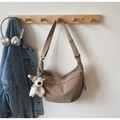 Detail of coffee brown crescent nylon bag with adjustable strap and cute bear charm - Khaki (With Charm)