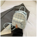 Detailed close-up of a mini gingham backpack featuring a cute bow and front zipper pocket - Blue