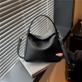 Minimalist black lychee pattern leather handbag with adjustable crossbody shoulder strap - Black