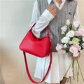 Red pebbled leather hobo handbag with silver hardware and adjustable straps - Red