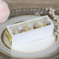 White laser-cut snowflake gift box with gold interior and luxury party favors - White