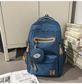 Détail du sac à dos en toile bleu foncé avec zips en cuir et pochette ronde suspendue - Avec Pendentif / Bleu