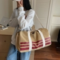 Large khaki canvas travel bag with white straps and red stripes on shoulder for women - Khaki