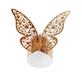 Macro shot of rose gold napkin ring with intricate laser-cut hollow butterfly pattern - Reflective Rose Gold