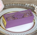 Detail view of laser-cut purple gift box with gold Love text on elegant ceramic plate - Deep purple