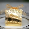 Laser-cut gold hollow LOVE candy box for weddings with ribbon bow on white ceramic plate - Reflective Gold