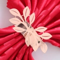 Close-up of rose gold leaf napkin ring featuring a hollowed-out metal foliage design - Mirror Rose Gold