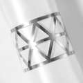 Macro shot of gold geometric triangle cutout napkin ring on a white satin cloth - Reflective Silver