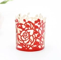 Detailed view of red laser-cut hollow rose pattern on a metallic LED candle holder - Reflective Bright Red