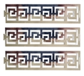 Macro view of reflective gold napkin rings featuring traditional Greek Key hollow patterns - Reflective Silver