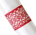 Macro view of red glitter laser cut napkin ring with elegant floral pattern on white silk - Glitter Red
