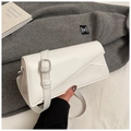 Detail of white leather shoulder bag with asymmetric flap and silver square buckle - White