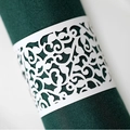 Elegant laser-cut white paper napkin ring with vine pattern on dark green fabric - White
