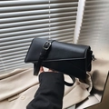 Minimalist black matte leather crossbody bag with asymmetric flap and silver hardware - Black