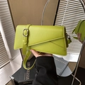 Neon green crossbody bag with asymmetric flap and decorative metal buckle strap - Green