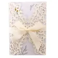Laser-cut cream glitter wedding invitation card with ribbon bow and gold floral insert - Glitter Iridescent Ivory
