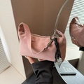 Pink suede underarm handbag featuring silver hardware and heart charm pendant detail - Pink with Pendant