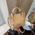 Chic white lychee pattern bucket bag with ZHCNMA embossing and golden hardware - Off-white