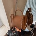 Classic brown pebble leather bucket bag with top handle and adjustable shoulder strap - Brown
