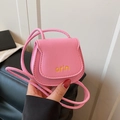 Mini pink crossbody saddle bag with flap closure and adjustable leather shoulder strap - Pink