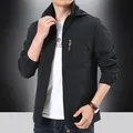 Men's black windproof hooded outdoor jacket with chest zipper pocket in loose fit - M / Black