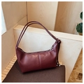 Detail showing the burgundy leather hobo bag's zip closure and shoulder strap knots - One Size / Burgundy