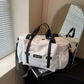 Large white travel duffel bag with black straps for sports and gym use - Off-white