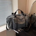 Dark grey high-capacity travel bag with adjustable shoulder strap and side drawstring pocket - Gray