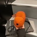Mini orange baseball cap crossbody bag with checkered texture and striped strap - Orange