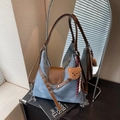 Blue suede tote bag with brown leather straps and a cute plush bear charm accessory - Denim Blue With Pendant