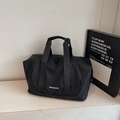 Large capacity black travel and gym bag with durable handles and waterproof matte finish - Black