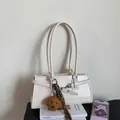 Minimalist beige leather shoulder bag with teddy charm and brown woven lanyard - White (With Charm)