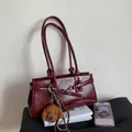 Deep red patent leather baguette bag with dual slim straps and plush puppy charm - Red (With Charm)